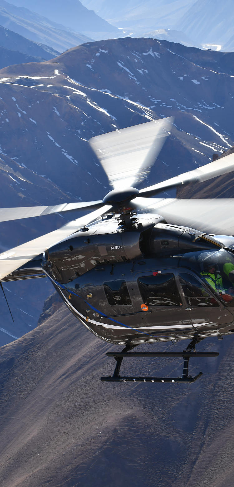 Five bladed H145 flying over mountains